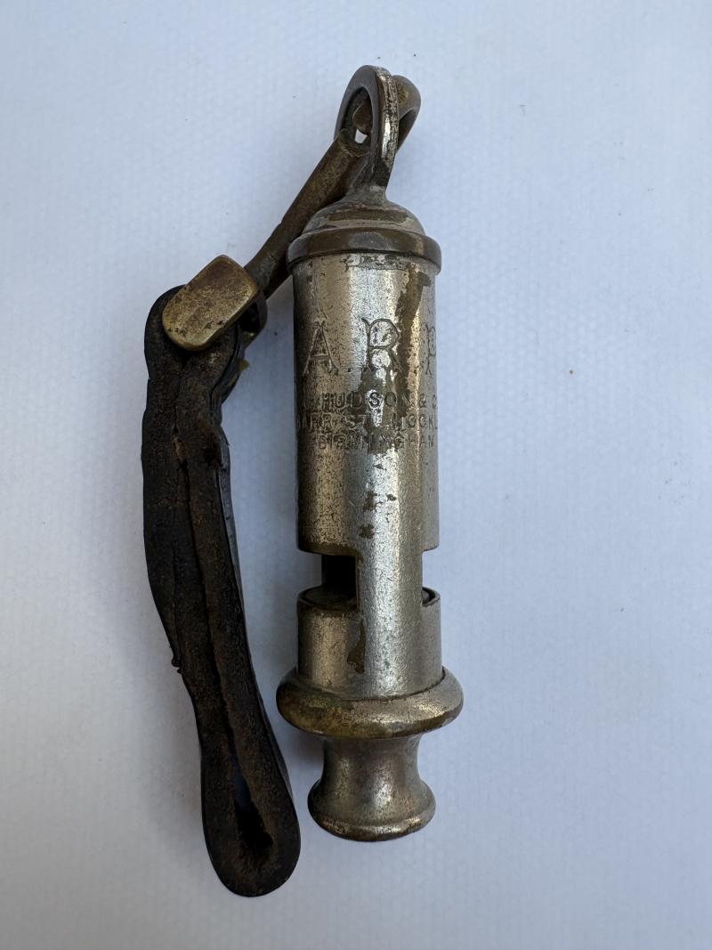 WW2 ARP WHISTLE ON LEATHER TAB (MARKED)